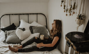 Young woman relaxing in bed